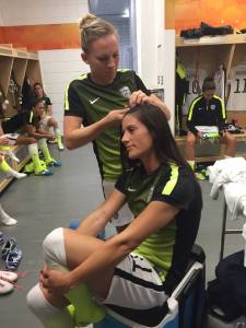 Amy Rodriguez and Ali Krieger preparing for a game